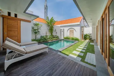 a house with a swimming pool in a yard at Villa Mailaku Seminyak in Seminyak