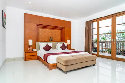 a bedroom with a bed and a large window at Bale Gede Luxury Villas by Moria in Canggu