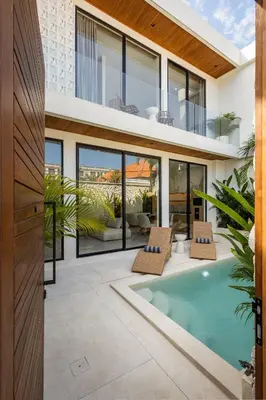 an exterior view of a house with a swimming pool at Villa Oasia 2 Seminyak in Seminyak