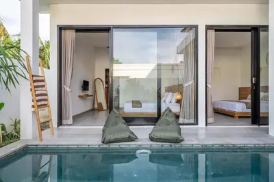 a house with a swimming pool and a bedroom at Peaceful 2BR Pool Villa in Kerobokan - V1 in Kerobokan