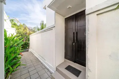 a hallway of a house with a black door at Peaceful 2BR Pool Villa in Kerobokan - V1 in Kerobokan