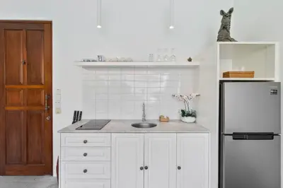 a kitchen with a sink and a refrigerator at Perfect for Couples and Solo Travellers in Seminyak
