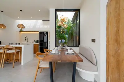 a dining room and kitchen with a table and chairs at Villa Grace&Glory-2 bedroom villa near Canggu in Kerobokan