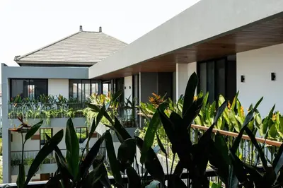 a house with plants in front of it at LOI Mansion Managed by ARM One Hundred in Seminyak
