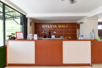 a lobby with a counter in a building at RedDoorz Plus near Mall Bali Galeria 2 in Denpasar