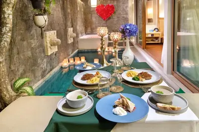 a table with plates of food on top of it at Ini Vie Villa Seminyak by Ini Vie Hospitality in Legian