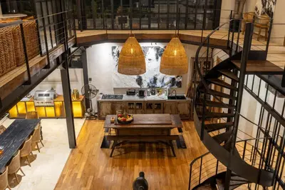 an overhead view of a kitchen with a table and a staircase at 4 Bedrooms Brand New serenity Villa in Seminyak