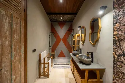 a bathroom with a sink and a mirror at 4 Bedrooms Brand New serenity Villa in Seminyak
