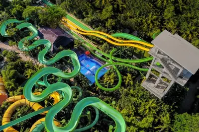 an overhead view of a water park with a roller coaster at ABI Hotel - 1 minute to the Beach and 1 second to the Mall in Ngurah Rai International Airport