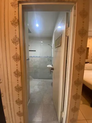 a bathroom with a shower with a glass door at SC Hotel - 1 Minute to the Beach By Micky Studio in Badung