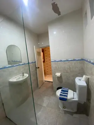 a bathroom with a toilet and a sink at SC Hotel - 1 Minute to the Beach By Micky Studio in Badung