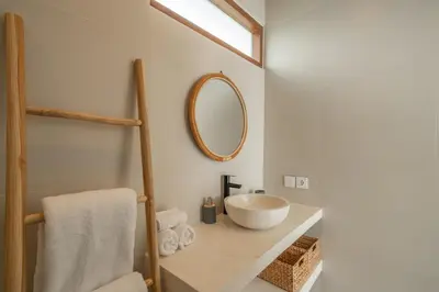 a bathroom with a sink and a mirror at Cute 2 Bedrooms Villa in Canggu in Canggu