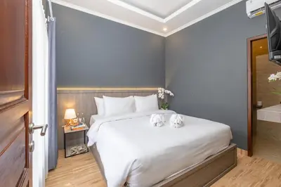 a bedroom with a bed with two stuffed animals on it at Rivera Seminyak 1 in Seminyak