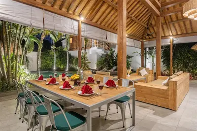 a dining room with a long table and chairs at Central Oberoi Seminyak Newly Renovated Villa Riva in Seminyak