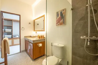 a bathroom with a toilet and a shower and a sink at 4 Bd Seminyak Scenic Rice Views 4 mins to Beach in Seminyak