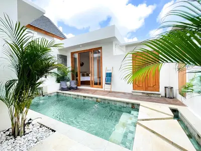 a swimming pool in the backyard of a villa at Villa De Tutti - 2BR Pool Villa Near Seminyak in Seminyak