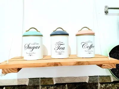a shelf with four coffee cans on it at 4 Bedroom Home with Pool near Canggu and Seminyak in Kerobokan
