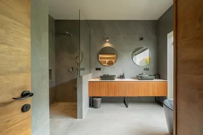 a bathroom with two sinks and a shower at Villa Merengue by BaliSuperHost in Seminyak