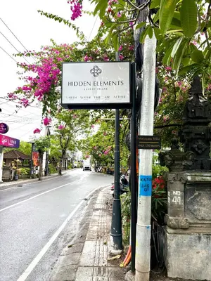a sign for the indian health institutes on a street at Mahayasa Villa with garden in Canggu