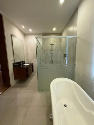 a bathroom with a bath tub and a sink at Avela bali villa in Kerobokan