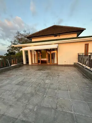 an empty parking lot in front of a building at Avela bali villa in Kerobokan