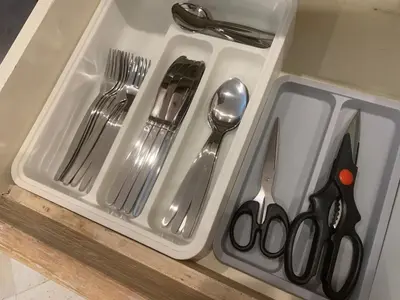 a plastic tray with utensils sitting on a counter at Heart of Seminyak 2bed 2bath 2 pools super quiet in Seminyak