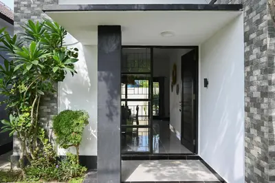 an open entrance to a house with plants at Villa Taman Sari in Nusa Dua