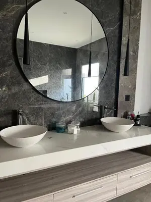 a bathroom with two sinks and a large mirror at Deo Villa Seminyak in Seminyak
