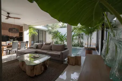 a living room with a couch and a table at Deo Villa Seminyak in Seminyak