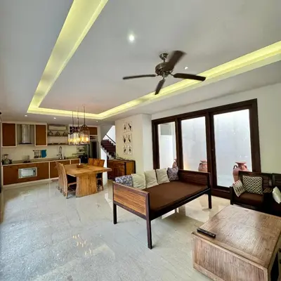 a living room with a couch and a table at Tolgay Living Villas in Seminyak