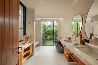 a bathroom with two sinks and a large mirror at New SASS Villa - Stylish & Modern 3BR at Seminyak in Seminyak