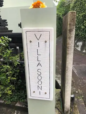 a sign that says voodoo on a post at Villa Sooni 1 in Seminyak