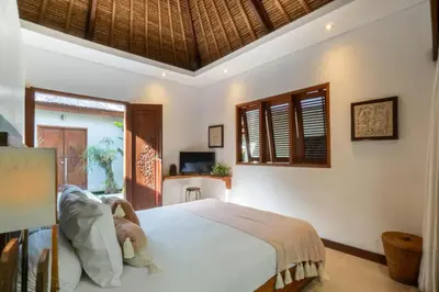 a bedroom with a bed in a room at Spacious Charming 4BR Balinese Villa, Seminyak in Kerobokan