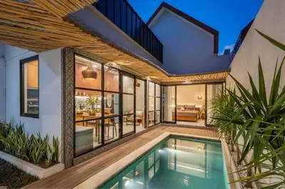 an external view of a house with a swimming pool at Modern and Petite 2bd Seminyak Villa Construction Near in Seminyak
