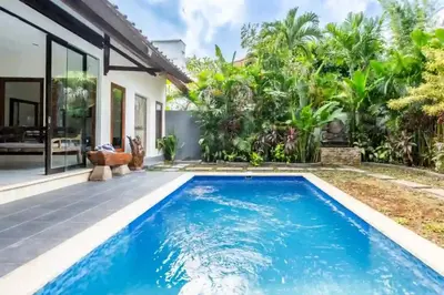 a swimming pool in front of a villa at Villa Durna 2 in Seminyak