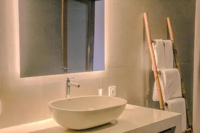 a bathroom with a bowl sink on a counter at Villa Sinergi Seminyak 7 in Seminyak