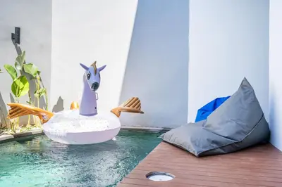 a toy llama in an egg boat in the water at Villa Baile Bali by Great Bali Villas in Jimbaran