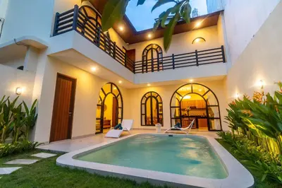 a house with a swimming pool in the yard at Villa Amaia Bali in Kerobokan