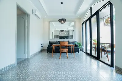 a living room with a table and a couch at Villa Mentari at Umalas in Kerobokan