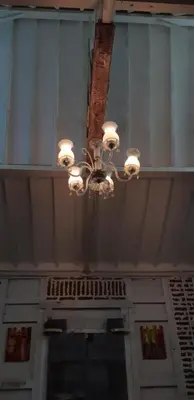 a chandelier hanging from the ceiling of a building at HI Lonny Villa Seminyak in Seminyak