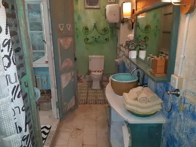 a bathroom with a sink and a toilet at HI Lonny Villa Seminyak in Seminyak