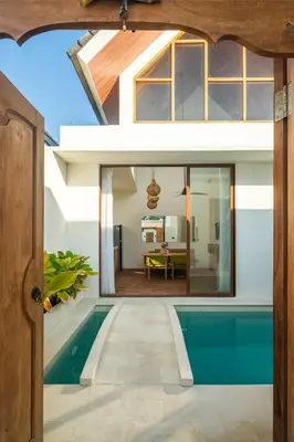 an external view of a house with a swimming pool at NEW! Villa Imaera - 2BR Villa in Kerobokan in Kerobokan