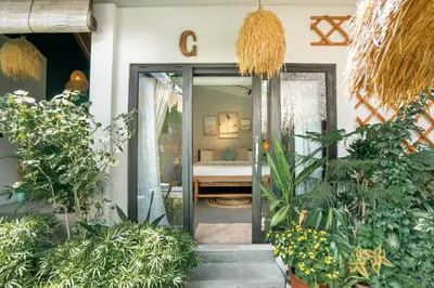 an open door into a room with plants at Villa Mint, 3Br Tropical Escape, Near Bintang Supermarket in Seminyak
