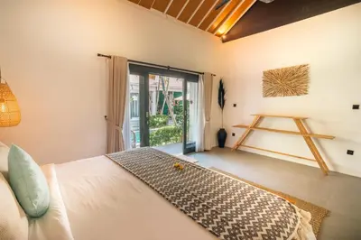 a bedroom with a bed and a large window at Villa Mint, 3Br Tropical Escape, Near Bintang Supermarket in Seminyak