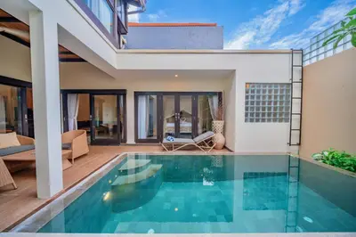 a swimming pool in the backyard of a house at Villa Cahaya Berlian in Kerobokan