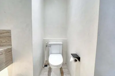 a bathroom with a white toilet in a room at Villa Isabella 4BR Brand New in Berawa, Canggu in Canggu