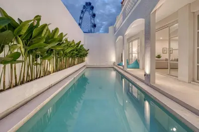 an indoor pool in a house with plants at Villa Isabella 4BR Brand New in Berawa, Canggu in Canggu