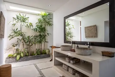 a bathroom with two sinks and a mirror at Seminyak Tropical Oasis Center-3 Br-Private Pool in Seminyak