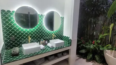 a bathroom with two sinks and a mirror at Seminyak Tropical Oasis Center-3 Br-Private Pool in Seminyak