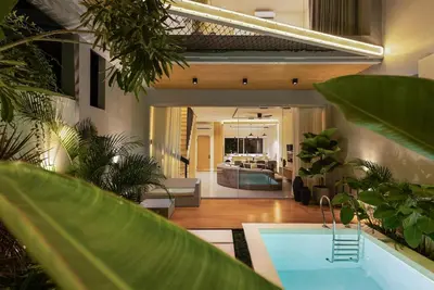a living room with a bath tub and a living room at New 2BR Architectural Masterpiece in Umalas in Kerobokan